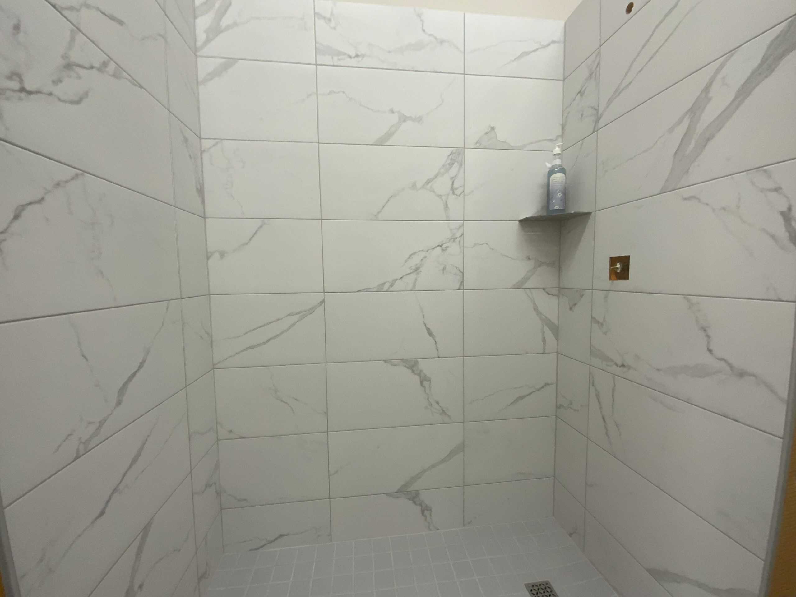 Essential Shower DWY - Marble Look 1 Essential Shower Kit in Marble Look finish by Mann Tile in Sarasota and Englewood.