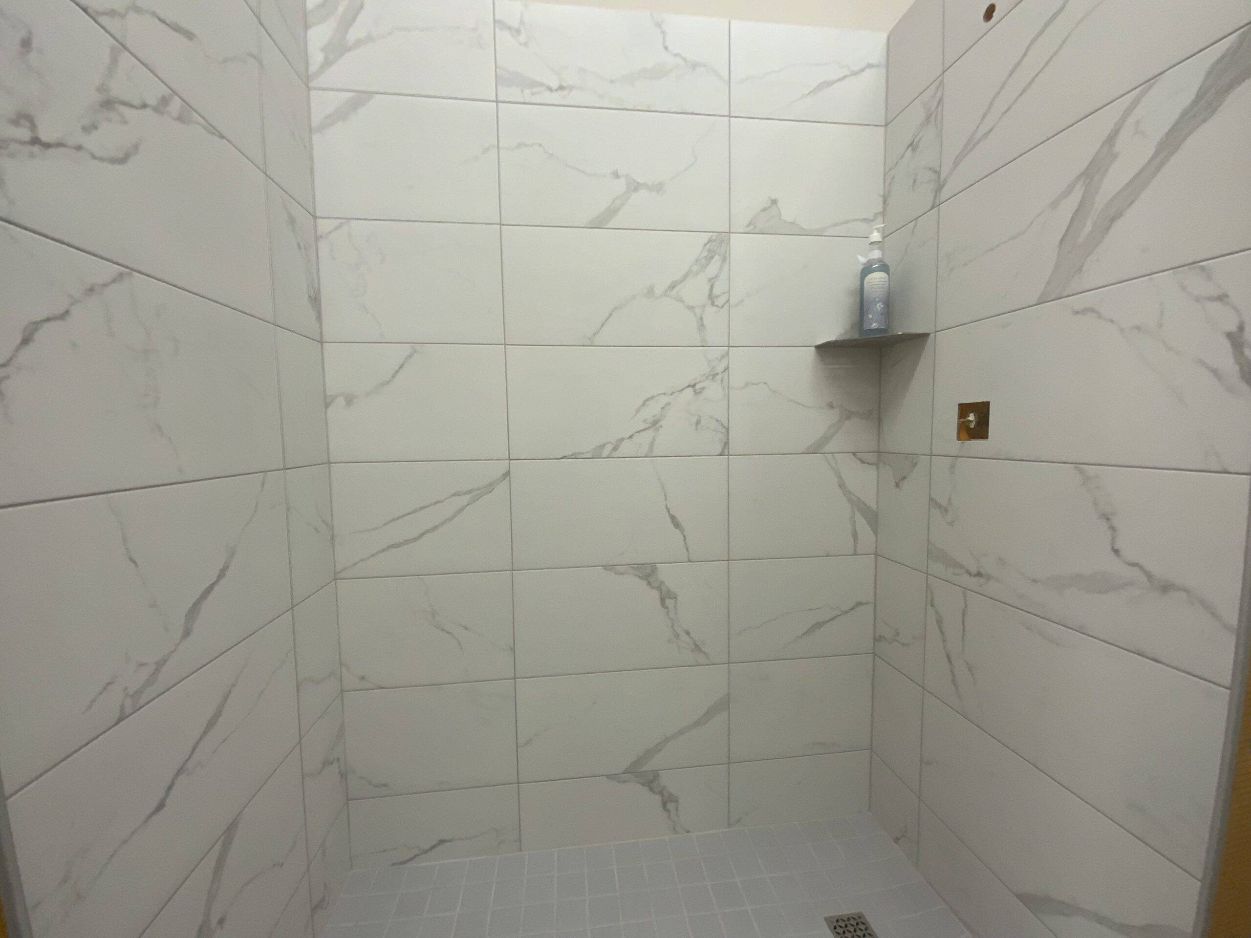 Essential Shower DFY – Marble Look (Full-Service Remodel) 1 Essential Shower Kit in Marble Look finish by Mann Tile in Sarasota and Englewood.